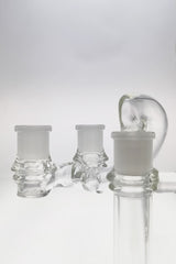 TAG Double Joint Shifter Adapter for bongs, clear glass, side view on seamless background