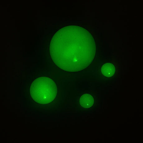 aLeaf Terp Pearls 4-Pack glowing in dark, essential dab rig accessories for enhanced vaporization