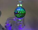 AFM UV Reactive Multicolor Glass Carb Cap on Dab Rig under UV Light - Top View