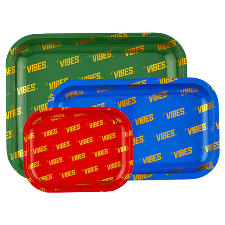VIBES Signature Metal Rolling Trays in red, blue, and green stacked on top of each other