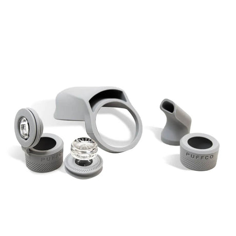 Puffco Peak Pro Travel Pack accessories displayed on white background, including silicone mouthpiece and carb cap