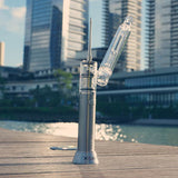 XVape V-One 2.0 Kit with Bubbler Attachment - Silver, Portable Dab Pen on Wooden Surface