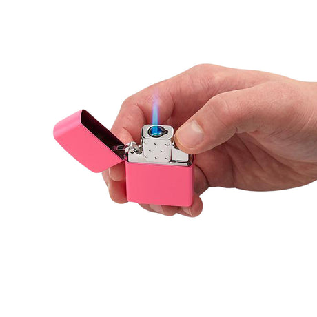 Hand holding Zippo Single Torch Lighter Insert in pink, with blue flame, portable and compact design