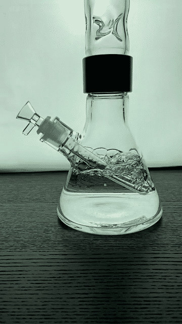 Prism CLEAR TALL BEAKER SINGLE STACK bong front view on a wooden surface