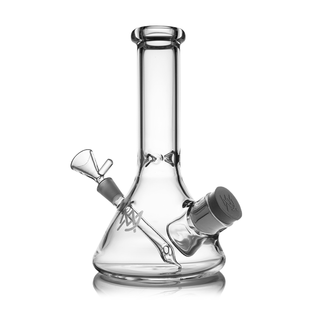 MJ Arsenal Cache Bong clear borosilicate glass with gold accents, compact beaker design, 45-degree joint