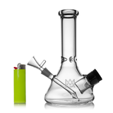 MJ Arsenal Cache Bong in clear borosilicate glass with 45-degree joint, front view beside a green lighter