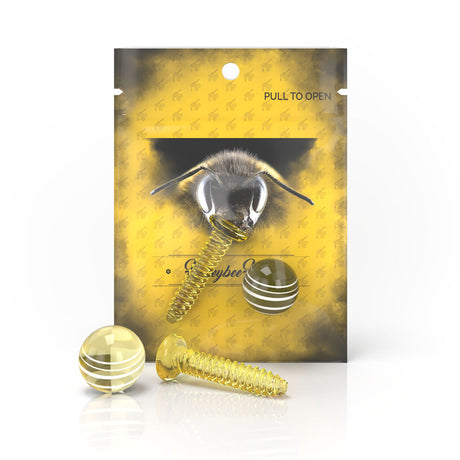 Honeybee Herb Dab Screw Set in Amber with Borosilicate Glass, front view on bee-patterned packaging