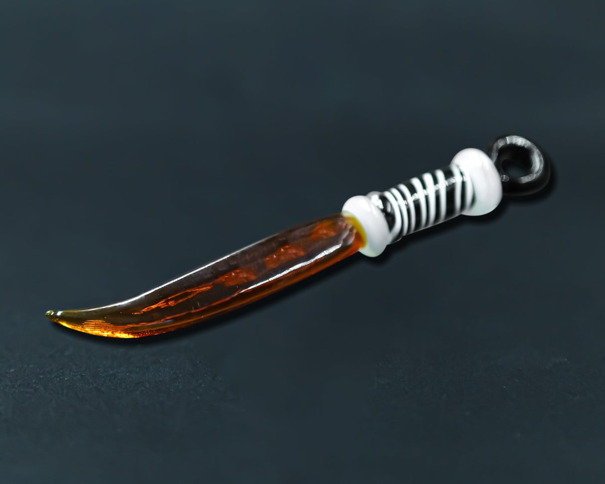 Honeybee Herb Glass Sword Dab Tool in Amber - Side View on Dark Background