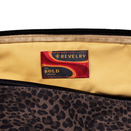 Close-up of The Drifter Smell Proof Rolltop Backpack by Revelry Supply with logo