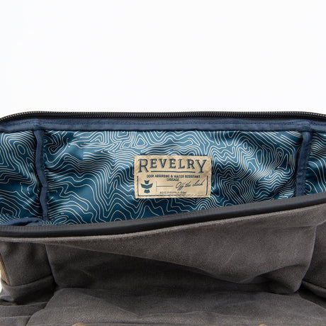 Close-up view of The Drifter Smell Proof Rolltop Backpack interior by Revelry Supply
