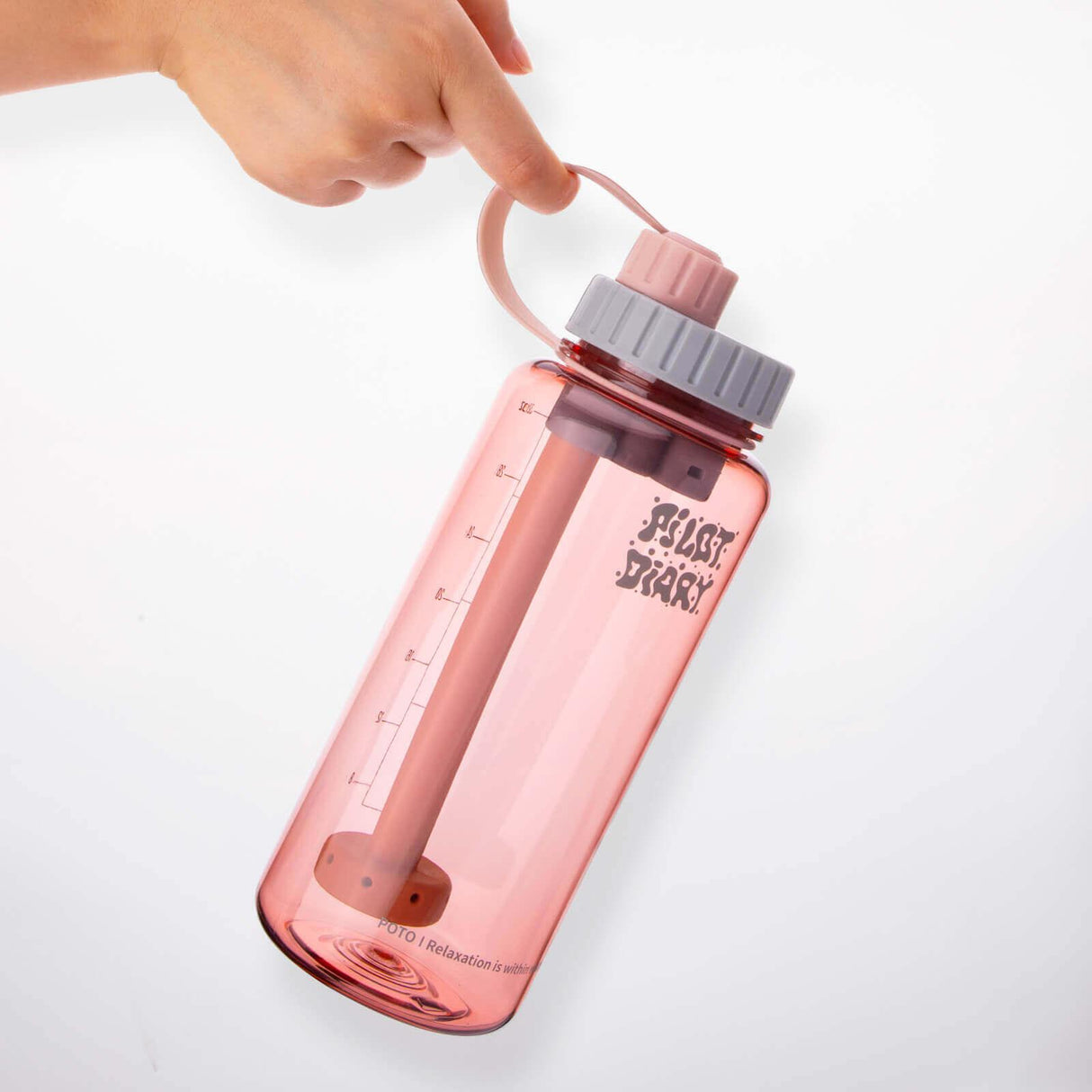 Pilot Diary POTO Water Bottle Bong in Pink, Hand-held Side View, Portable and Discreet