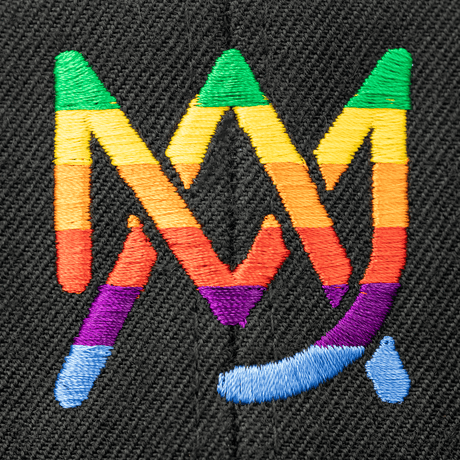 Close-up view of MJ Arsenal Rainbow Logo on a black hat, showcasing vibrant colors and fun design