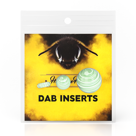 Honeybee Herb Dab Marble Set with glow-in-the-dark borosilicate glass spheres on yellow background