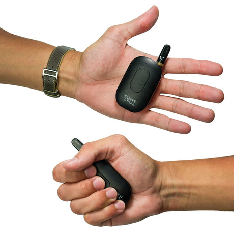 Freeze Pipe Vape Pen held in hands showing compact size and ergonomic design, ideal for on-the-go use