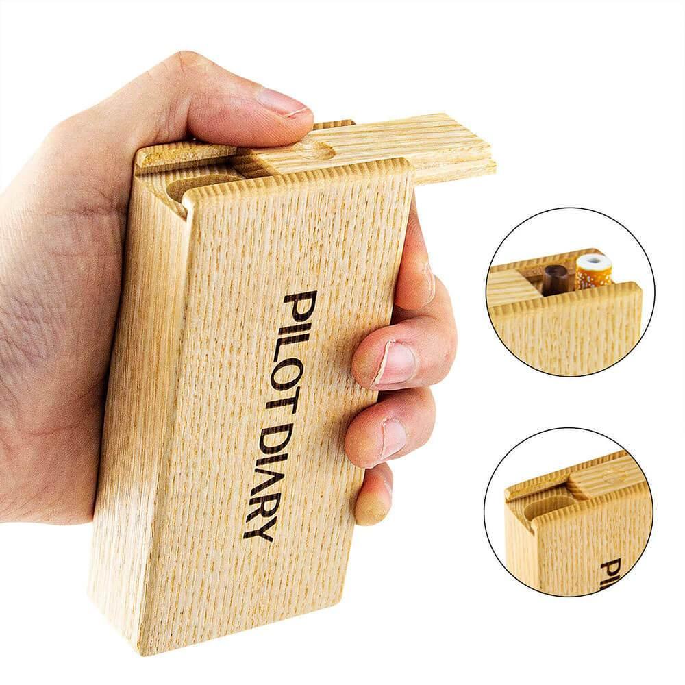 Hand holding PILOT DIARY Wooden Dugout with Cleaning Tool, front view with open compartments