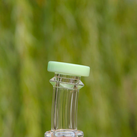 Close-up of Calibear Colored Mini Can Dab Rig with Green Accents and Borosilicate Glass