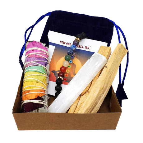 Chakra Balancing Sage Smudging Kit with colorful wrapped sage, bracelet, and palo santo in a box