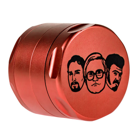 Red aluminum 4-part herb grinder with diamond-shaped teeth, side view on white background