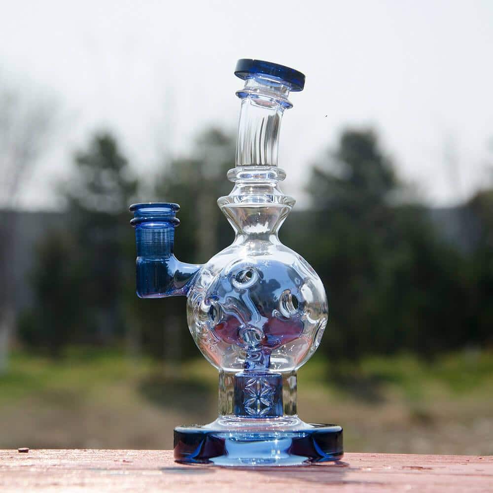 Calibear EXOSPHERE Dab Rig with Seed of Life Perc in Blue, front view on natural backdrop