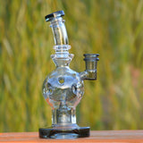 Calibear EXOSPHERE Dab Rig with Seed of Life Perc, clear glass, side view on natural background
