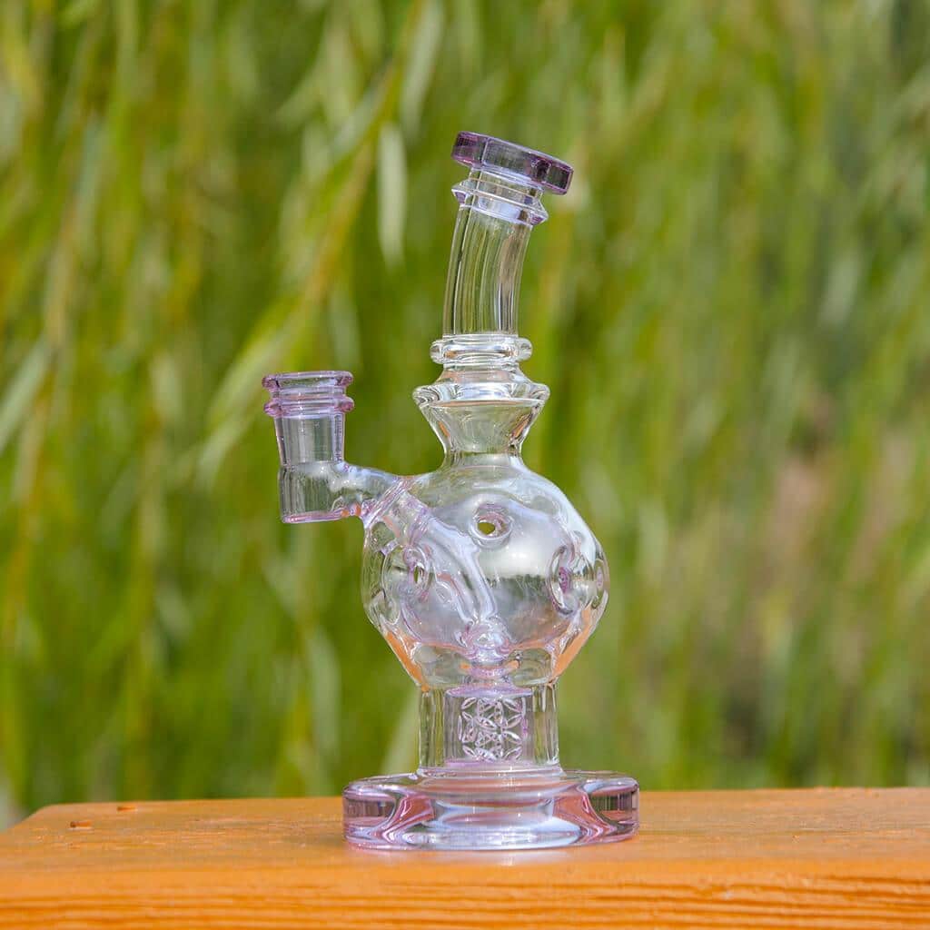 Calibear EXOSPHERE Dab Rig with Seed of Life Perc, clear glass, front view on wooden surface