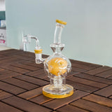 Calibear EXOSPHERE Dab Rig in Mango, with Seed of Life Perc, side view on wooden surface