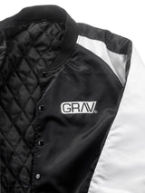 Close-up of GRAV Satin Bomber Jacket with quilted design and logo on chest