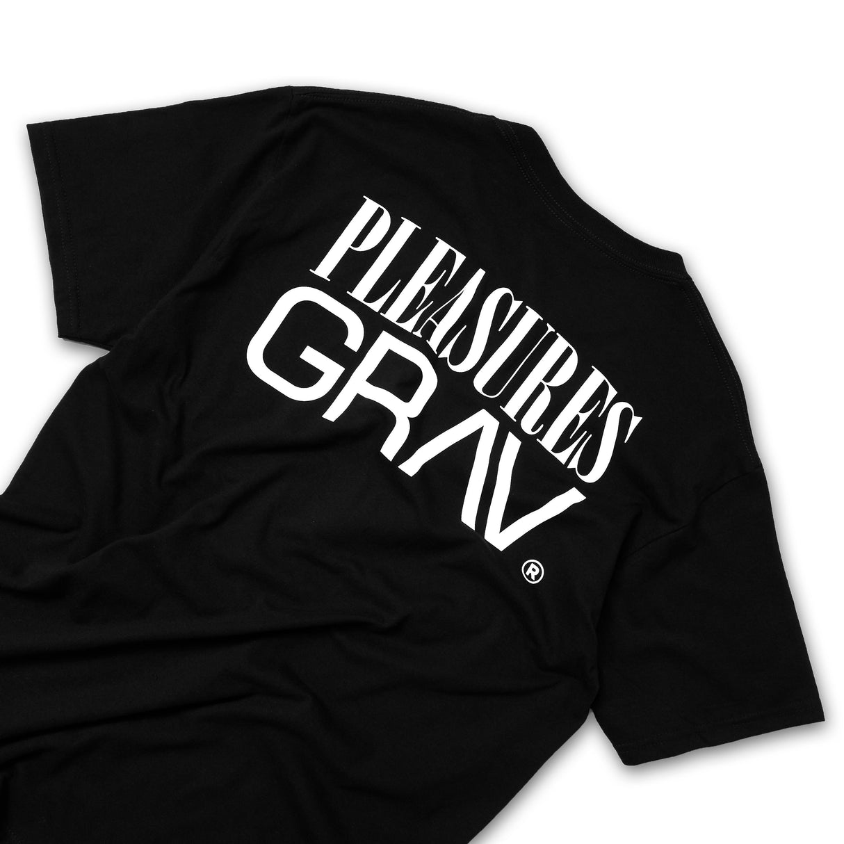 GRAV Working from Home Black T-Shirt with white PLEASURES logo, top view on seamless background
