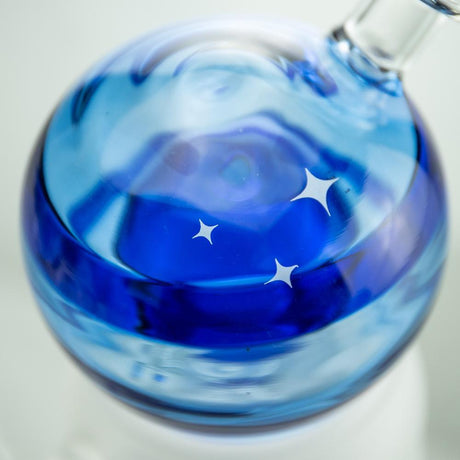 Hemper Crystal Ball XL Rig with blue swirls and stars design, close-up side view, 7" height, 14mm joint