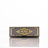 Hemper Notes Hemp Rolling Papers 24-Pack Front View on Reflective Surface