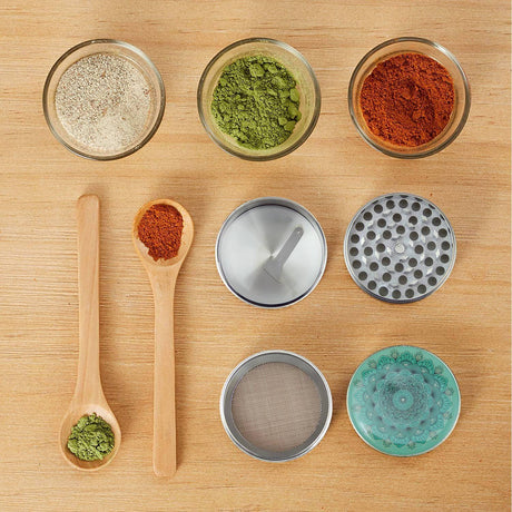 Pilot Diary Mandala Grinder Silver disassembled view with spices on wooden surface