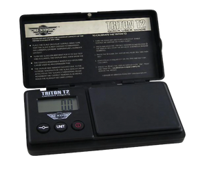 MyWeigh Triton T2 120g x 0.1g digital pocket scale open with user guide, battery-powered, portable design