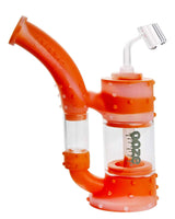 Ooze Stack Silicone Bubbler in orange, 7" tall, with quartz banger, angled side view