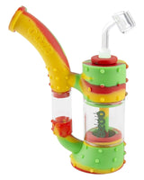 Ooze Stack Silicone Bubbler in Rasta colors, 7" tall with quartz banger, front view on white