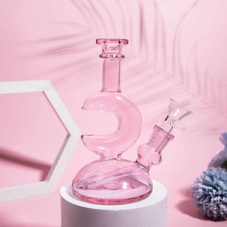 PILOTDIARY Pink Moon Dab Rig front view on display, with intricate glasswork and sturdy base