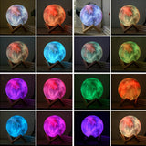 Planet Color Changing Cordless LED Lamp displaying various hues on a wooden stand