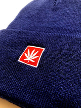 Close-up of StonerDays 12" Knit Navy Blue Beanie with Red Leaf Logo