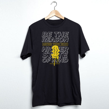 StonerDays black cotton t-shirt with 'Be The Reason' graphic, medium size, front view on hanger