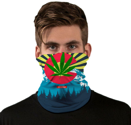 StonerDays Colorado Face Mask featuring vibrant cannabis leaf design, worn by model, front view