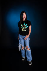 StonerDays Men's Enjoy Palm Trees Tee in black cotton, front view on model with blue background