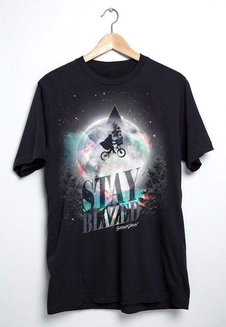StonerDays ET Moon Tee in black, featuring cosmic design with cyclist, front view on hanger