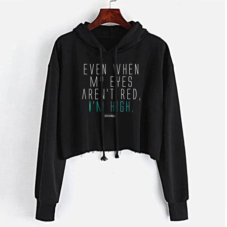 StonerDays black crop top hoodie with "Even When My Eyes Aren't Red, I'm High" text, front view