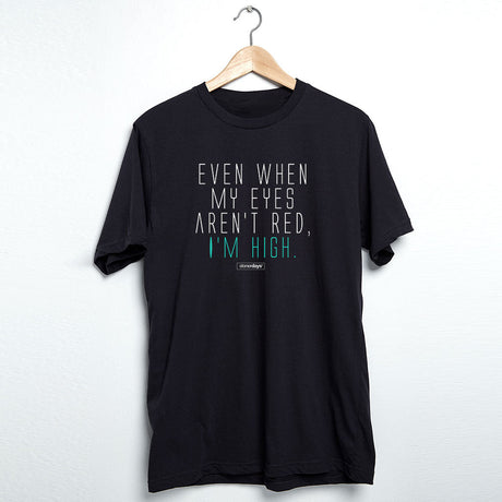 StonerDays men's black t-shirt with 'Even When My Eyes Aren't Red I'm High' print, front view on hanger