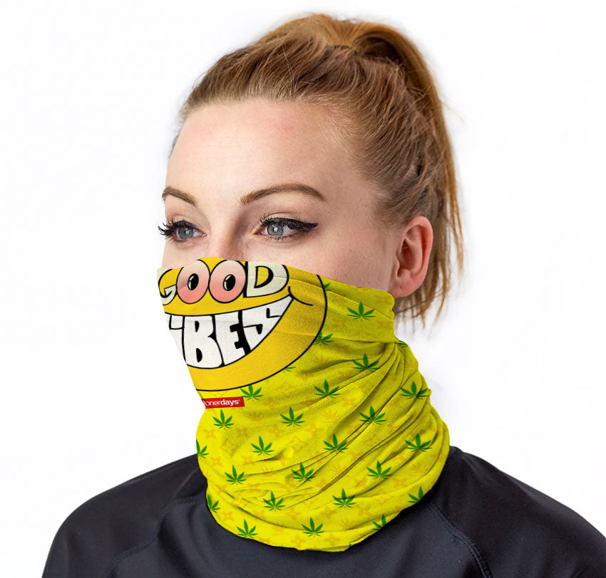 StonerDays Happy Face Good Vibes Neck Gaiter with cannabis leaf pattern, front view on model