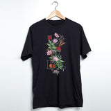 StonerDays Let It Be men's black t-shirt with vibrant botanical design, front view on hanger