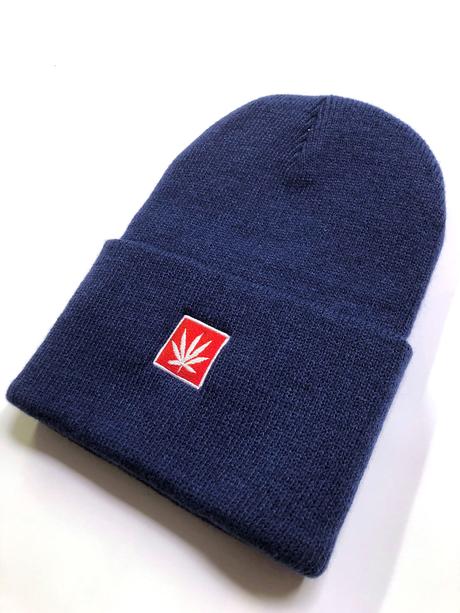 StonerDays navy beanie with red cannabis leaf design, front view on white background