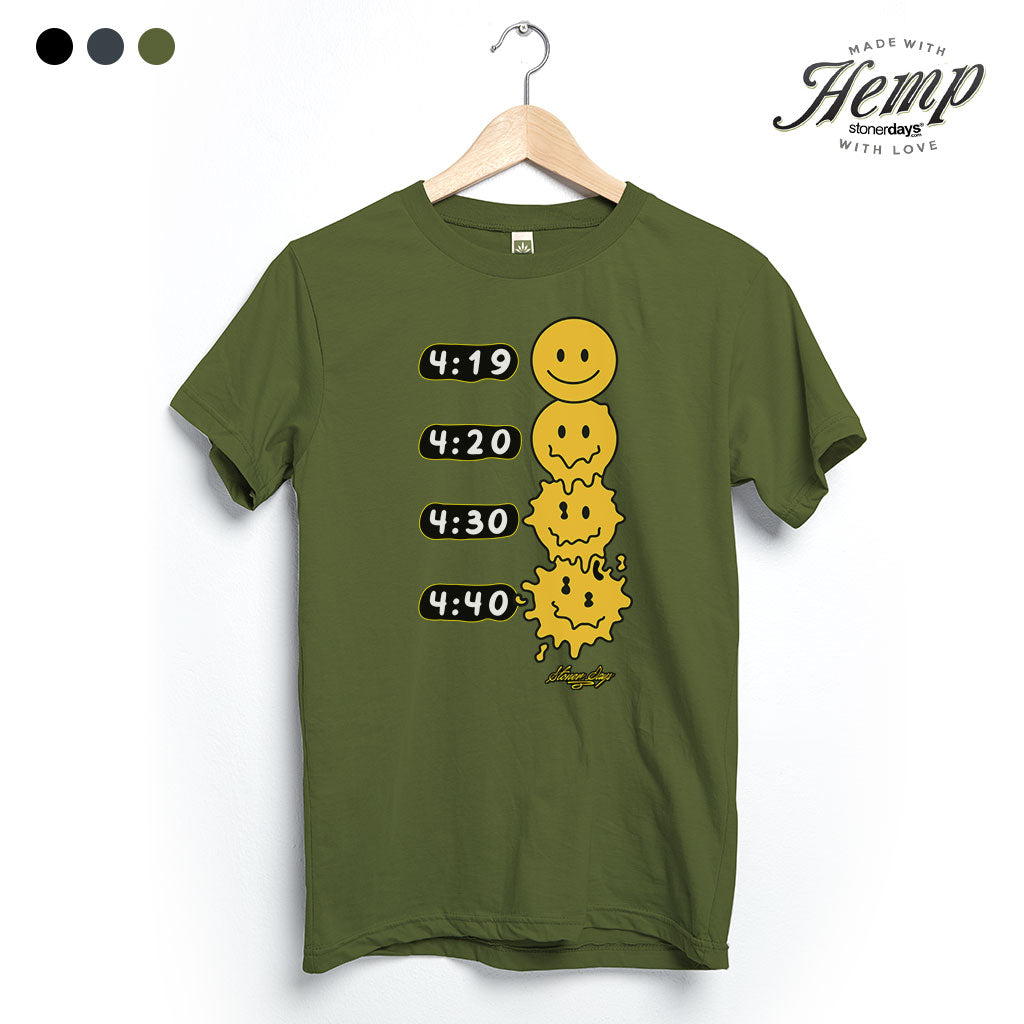 StonerDays Melted Faces Hemp Tee in Herb Green, front view on hanger, with smiley face design