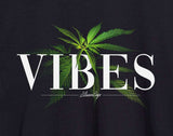Close-up of StonerDays Men's Vibes Tee with cannabis leaf design, made from comfortable cotton