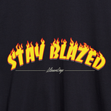 Close-up of StonerDays Stay Blazed Flames Hoodie with fiery text design