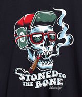 StonerDays men's t-shirt with 'Stoned To The Bone' graphic, close-up view on black fabric